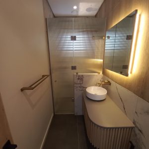 Frameless In-Line Shower Enclosure with Reeded Glass