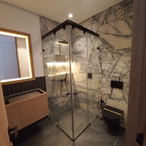 Frameless Sliding Shower Enclosure with Black Hardware